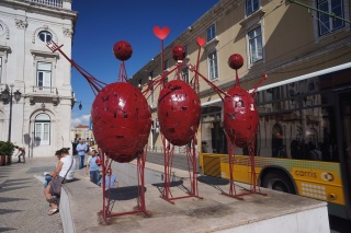 On the way back to Bairro Alto, red art creatures