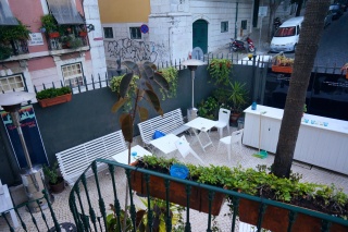 The Oasis Hostel courtyard left, empty at 8:00 am