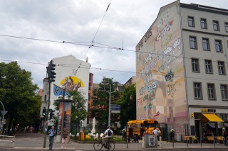 Big street art with a touch of graffiti on the way home