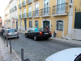 Theresa and our taxi wondering what Brian is doing over there
