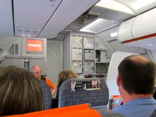 So many seats, an open kitchen. As interesting is that before Brian had the camera down, the flight attendant was scolding him for taking his picture
