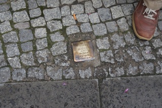 Stumbling stone. The name of a Jewish holocaust victim in front of where he used to live. All over Berlin