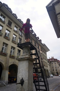 Back in town, Theresa on an old column. The stairs really impact the effect
