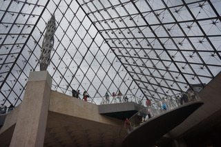 The Louvre, from inside the glass pyramid. Looking up at the rain, amongst other things
