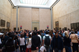 ...from this. The Mona Lisa mosh pit you must make your way through to get that shot