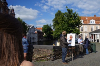 Plein air portraiture, the subject is behind the easel