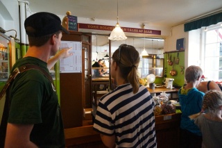 Ulf helping Theresa deal with a local candy store where they are making the treats right back there