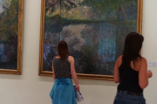 Theresa eyeing some Monet. She was making a monitor very nervous with her closeness