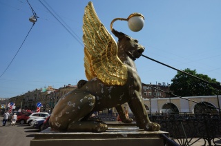 Gold winged suspension bridge cable breathing lion