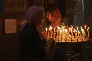 Candle tender in the first cathedral