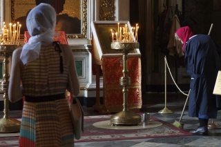 A lady sweeping up candle dust
