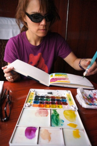 The sunglasses are part of the rock star artist schtick