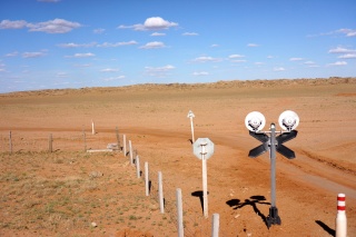 A well engineered train crossing, seemingly in the middle of nowhere