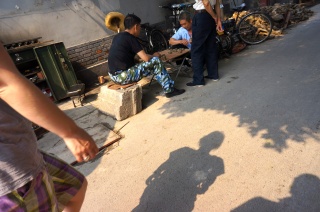Men playing games in our alley