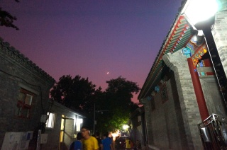 The moon over our alley on the way to dinner