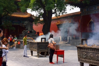 Lighting incense for prayer