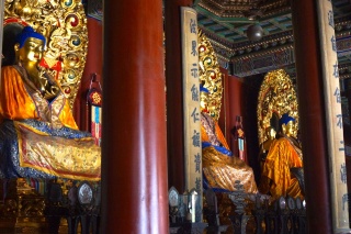 Three Buddhas in a room