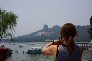 Theresa, shooting the Tower of Buddhist Incense across lake Kunming
