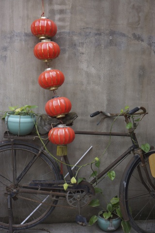 Lanterns and a bike outside our door