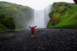 Brian, celebrating the grandeur of Skogafoss