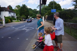 Brian pushing a stroller. Someone is not thinking