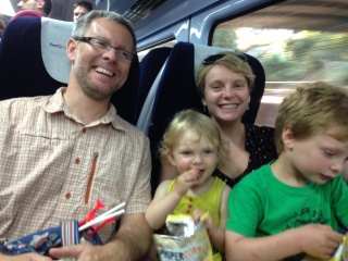 Only a beautiful family of four can look this happy in two seats
