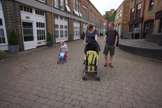 Lili with Colette's stroller. Colette with her own.