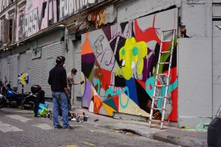 Two gentlemen working on sanctioned public art