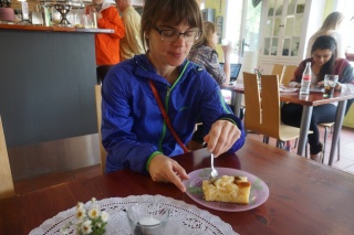 Theresa, treating a little apple cake with the seriousness it deserves