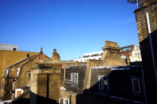 London rooftops and chimney pots — clear blue morning