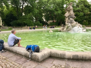 He's about to fall asleep into a fountain