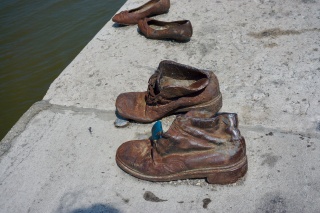 Jews were ordered to take off their shoes and shot, falling into the river