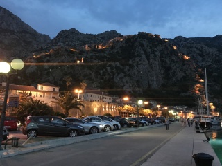 The lights over Old Town follow the fortress wall up the hill behind