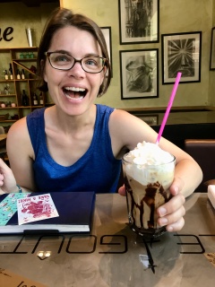 At our new favorite cafe. Theresa is super okay with her iced coffee