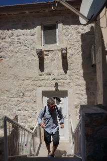Up the steps one more time, pack and all.