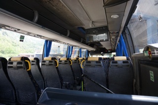 Our bus. Blue seats, a window, good enough.