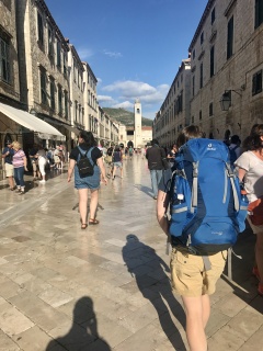 Backpacks down the Stradun, bell tower pulling us along.