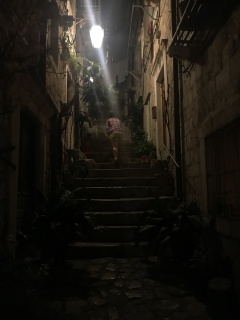 A Dubrovnik alley, lit from above. This way to dinner.