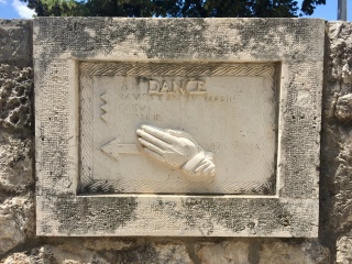 A carved hand on the wall that just says DANCE. Noted.