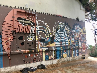 More of the wall: brown, blue, and a little mask-like.