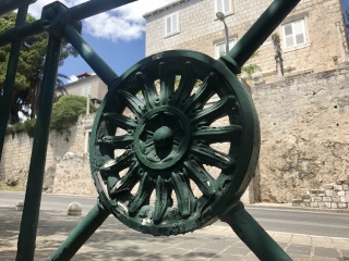 A green iron wheel on a railing. We never figured out why.