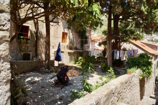 Someone's afternoon courtyard, laundry inarguably done.