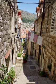 A stepped alley with the mountain at the end of it.
