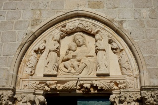 Madonna and child over the door, angels in the corners.