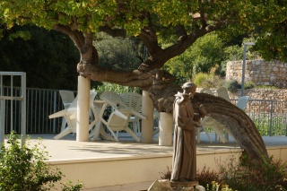 A winged Saint Francis keeping the Franciscan terrace.