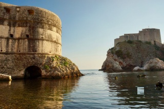 Bokar on the left, Lovrijenac on the right, a kayaker threading the middle.