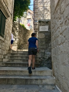 She takes the stairs up Pucića.