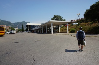 Split bus station. He has the day pack.