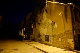 A mural that keeps to itself after dark.
