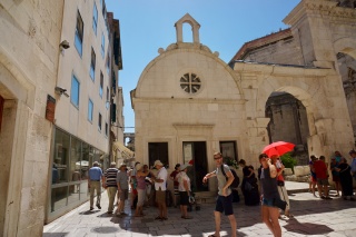Another small chapel, another square, another red umbrella.